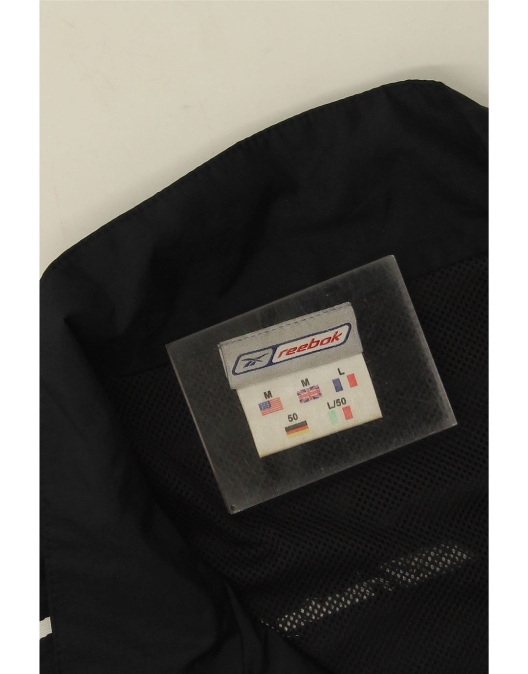 Męska kurtka dresowa Reebok o luźnym kroju, średnia czarna, z blokami kolorów